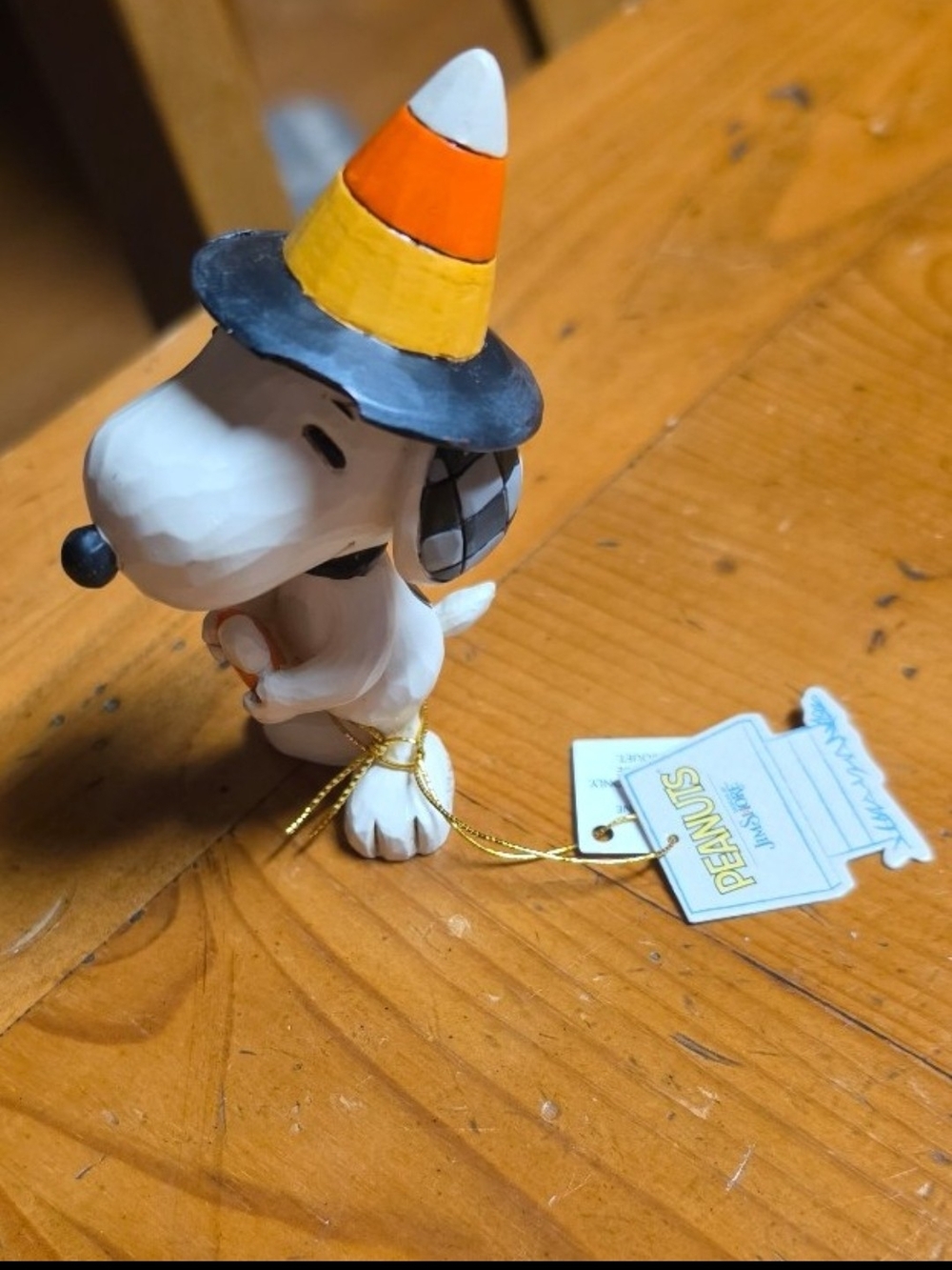 Jim Shore Peanuts Snoopy Dog Figurine Ornament in White with Candy Corn Hat